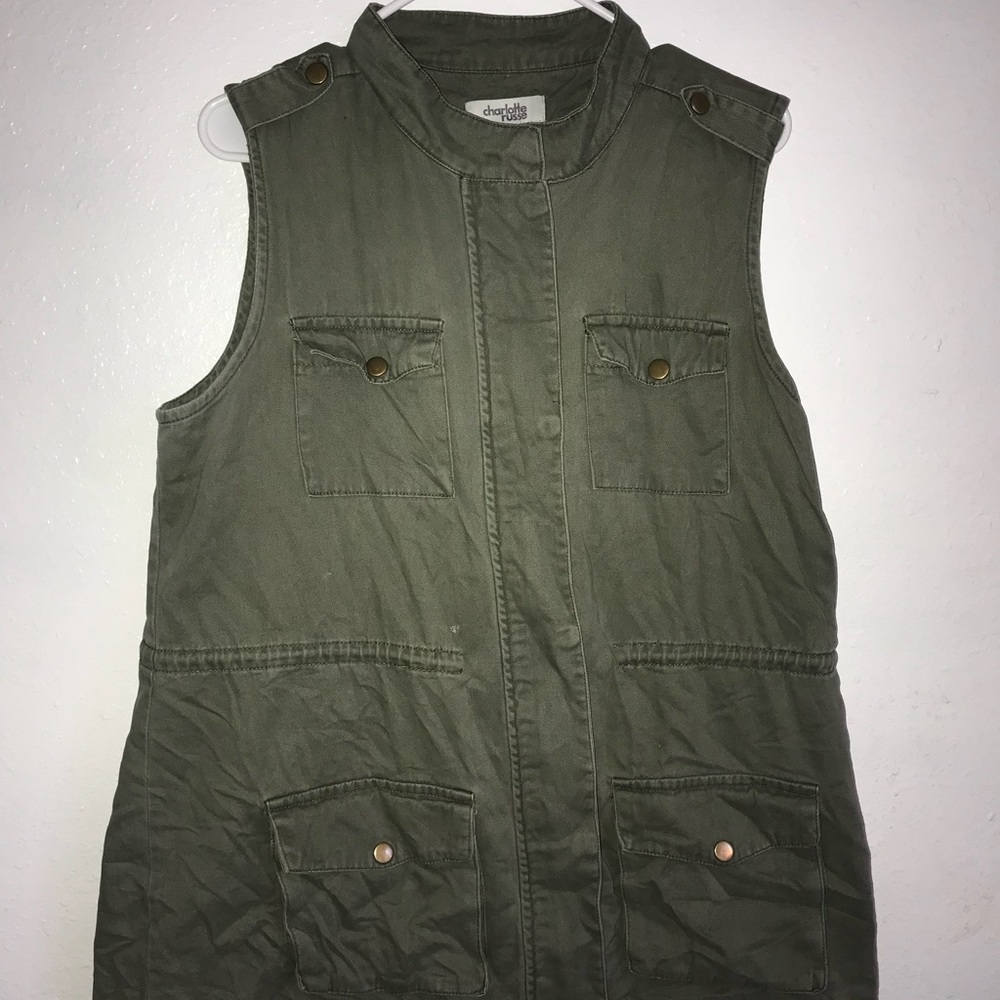 A dark green no sleeve jacket